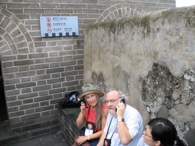 Joanne and Rick with cell phones on the Great Wall