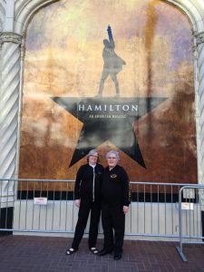 Posing in front of the Hamilton poster